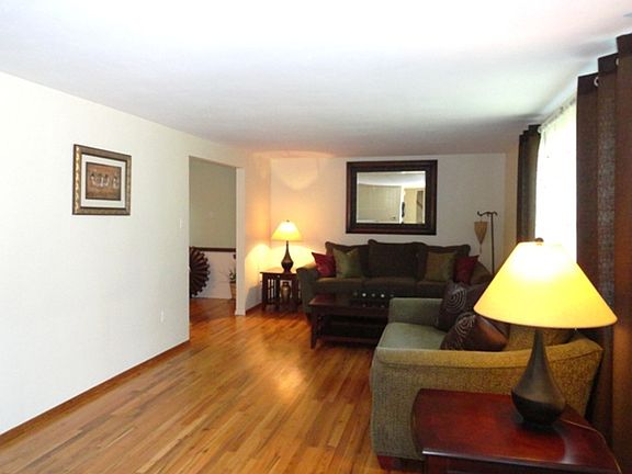 Living Room with hardwood floors measuring  21x13.