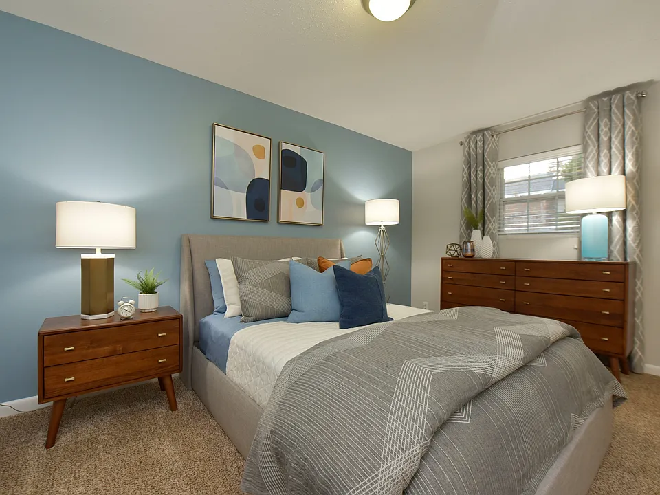 Cozy bedroom with carpet and overhead lighting