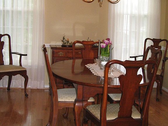 Dining Room w/ Chair Rail and Hardwood Floors