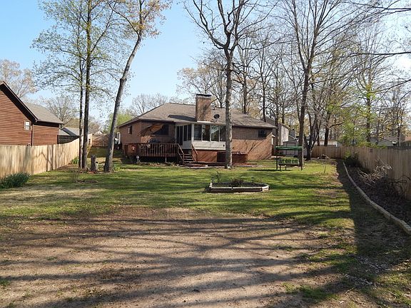 huge back your with lake access
						:
						Lots of flowers beds with underground electricity through out the yard
