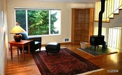 Living room and stairs up to third floor