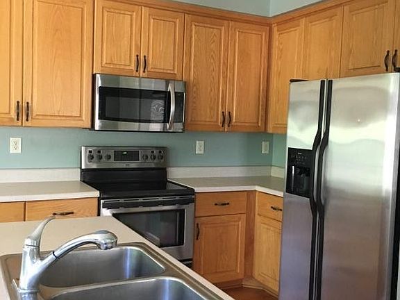Kitchen hs updated stainless appliances and a pantry.