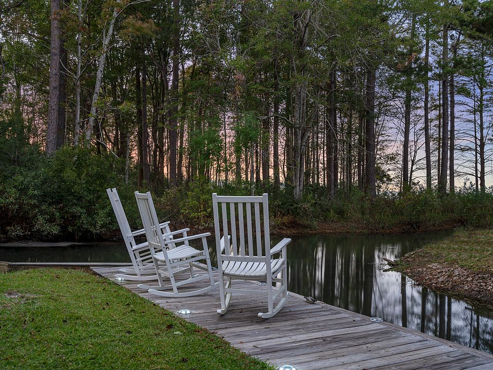 Just off the open lake, home sits along a private canal with private boat landing in the backyard.
