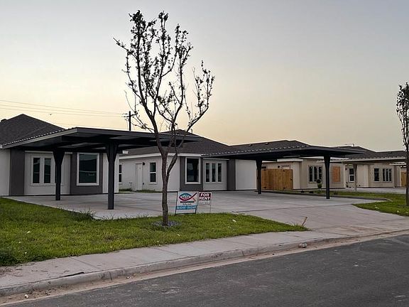 Front/Side View of 4 plex with covered parking