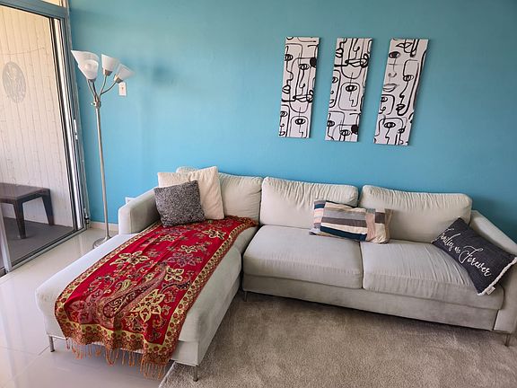 Living room with sofa, lamp, 50" LED TV, Wi-fi, entertainment center