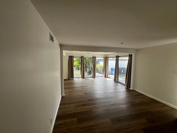 Den with patio-garden access