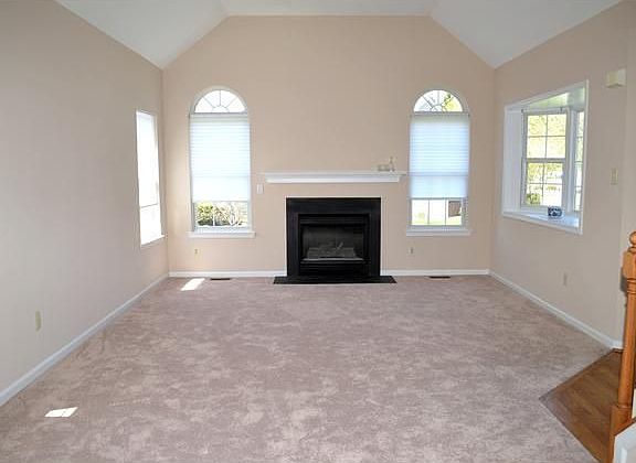 Soaring ceilings and neutral paint in living room
