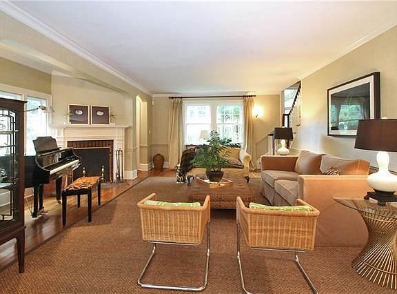 Living room with fireplace and maple floors