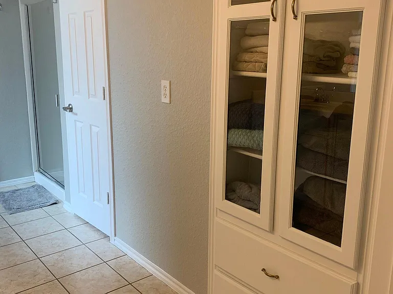 Master bath has linen storage, separate toilet closet and step in shower.