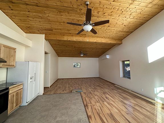 Kitchen, dining room, living room (without furniture).