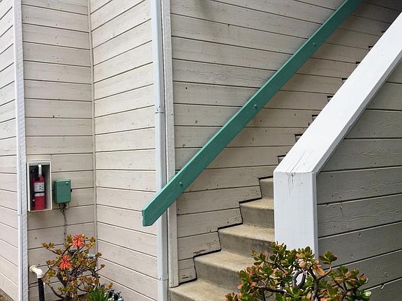 Stairs to the entry on the second floor.
