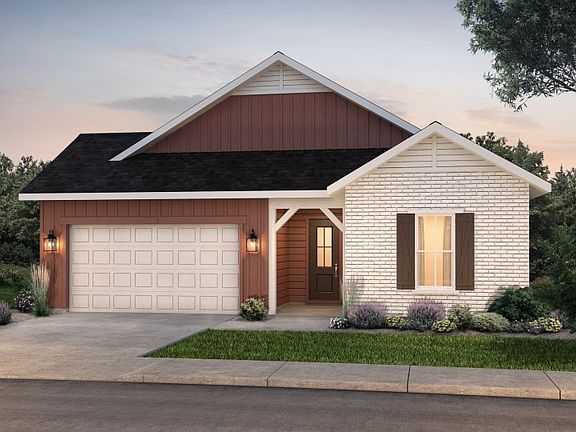 The classic Farmhouse elevation boasts stylish brick accents and window shutters for added curb appe