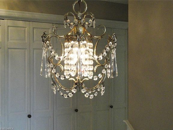 Chrystal chandelier in center of grand staircase