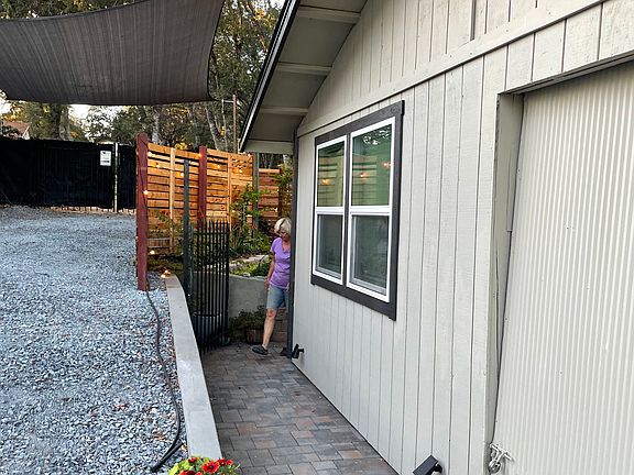 Walkway to front gate and entrance to patio garden area and front door.