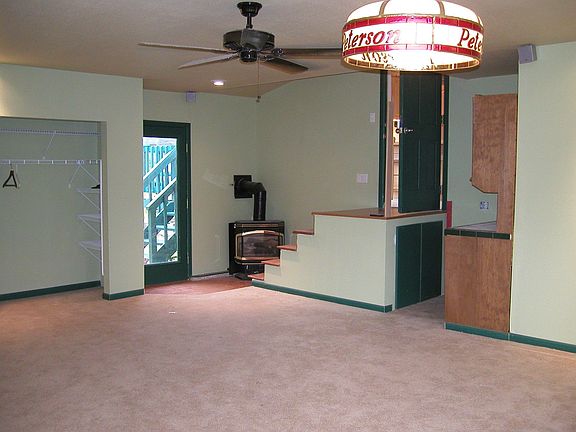 Rec room with gas fireplace. Room is wired for home theater and pool table