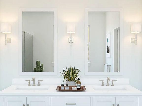 Primary bath with freestanding vanity and brushed nickel faucets