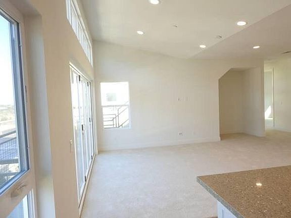 super bright living room with floor to ceiling windows