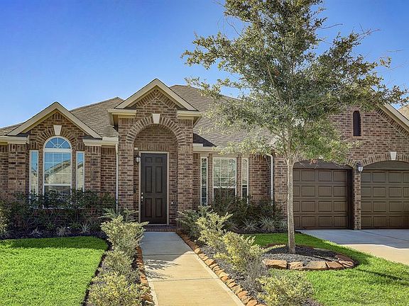 This home has wonderful curb appeal with upgraded garage doors, lovely landscaping, and an impressive covered porch.