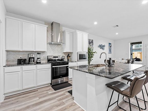 Kitchen with appliances and utensils