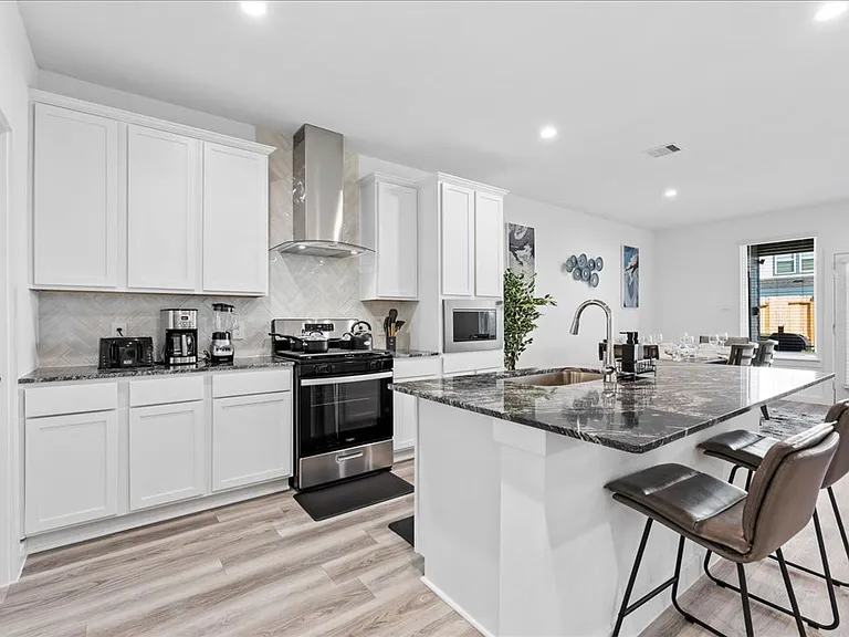 Kitchen with appliances and utensils