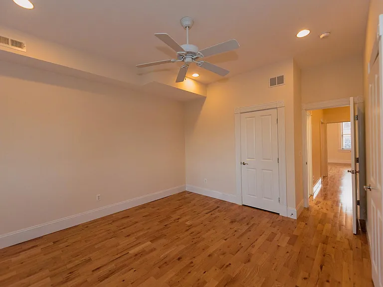 Bedroom two (east-facing) with double closets