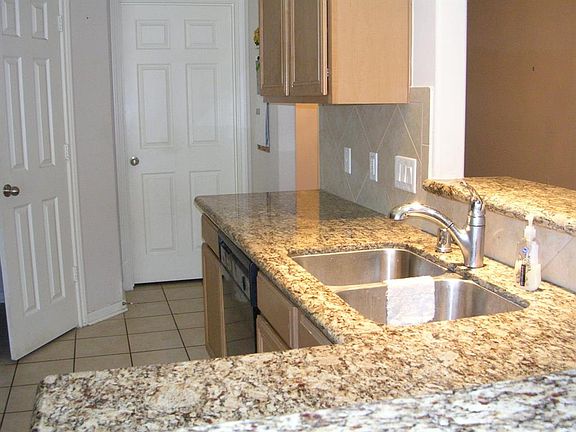 Beautiful granite counter tops, deep double stainless sink and lots of area to create your favorite recipes