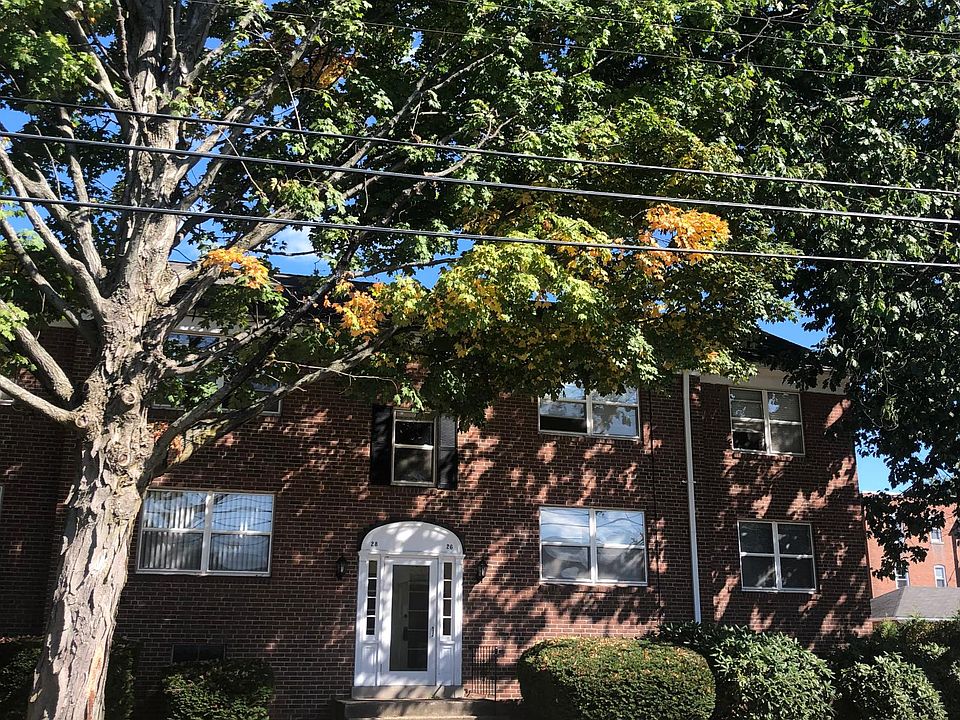 Front of building & front door/entry foyer with mailboxes & guest intercom.