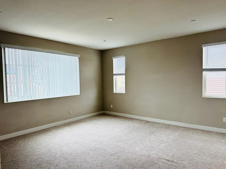 Master suite with blinds on