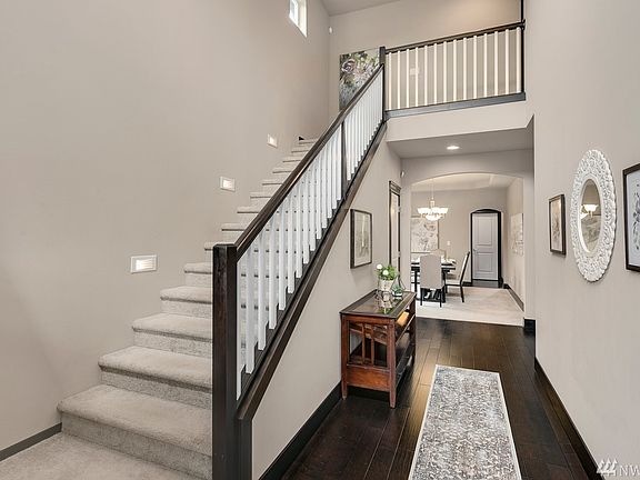 Bright, open entry. Tread lighting on stairway