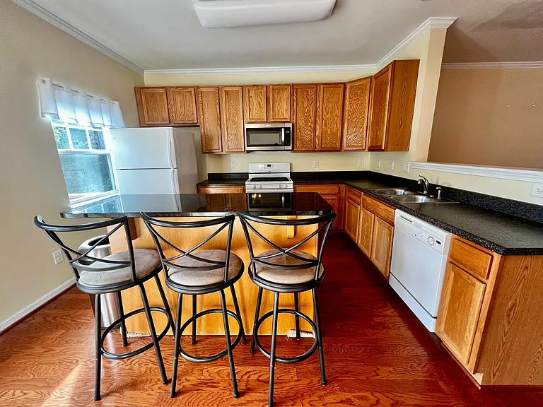 Refrigerator, gas stove, microwave, and dishwasher included!