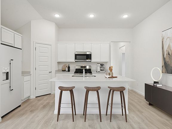 Kitchen in the Cypress home plan by Trophy Signature Homes - REPRESENTATIVE PHOTO