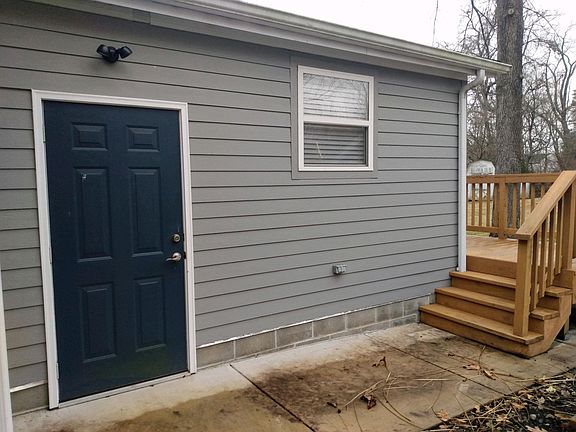 BASEMENT ENTRANCE. SMALL DECK