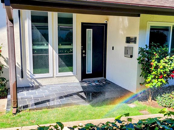 Front door. Mail/packages delivered right to here. Smart-lock on door provides keyless access using a PIN code.