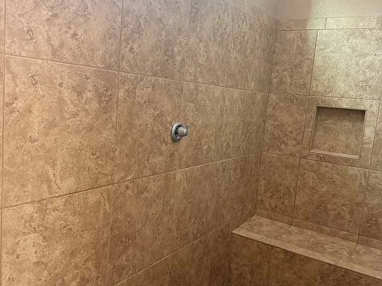 primary shower with bench