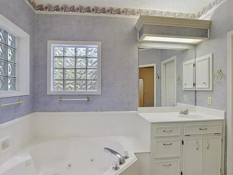 corner Garden tub, sink, 
Lots of cabinets
