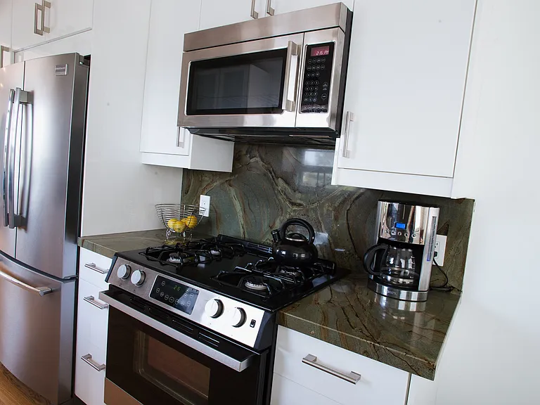 Stone Countertops and Stainless Steel Appliances