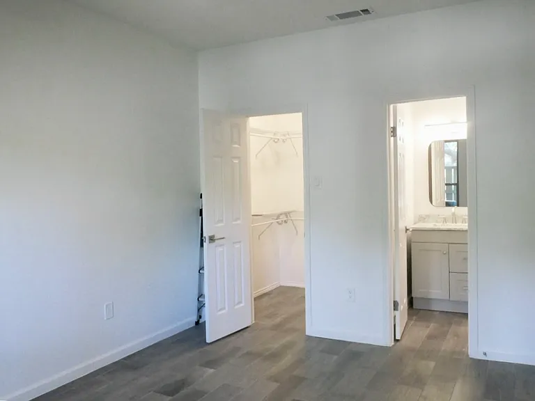 Primary Bedroom with Walk-in Closet and Private Patio