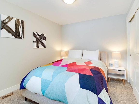 Large guest bedroom on 2nd floor has plenty of room for a queen sized bed and end tables. Vinyl faux wood floors (no carpet)