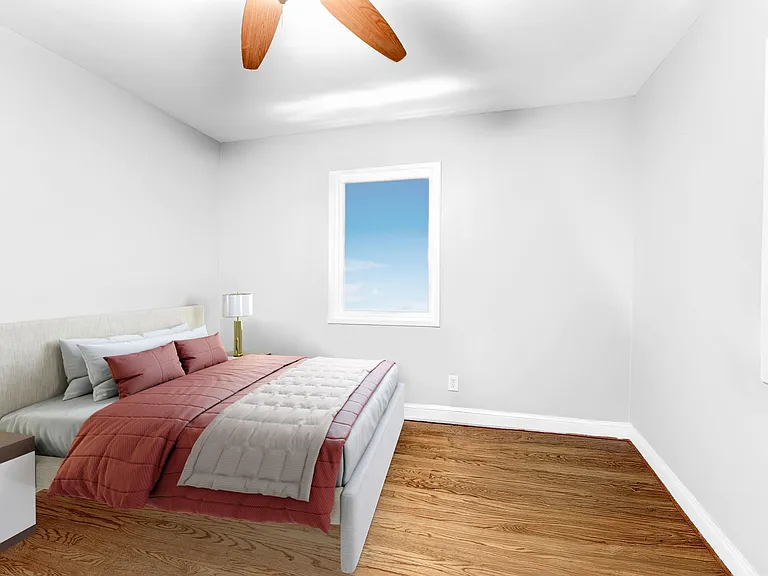 Main level 2nd bedroom can hold queen-size bed with desk and dresser