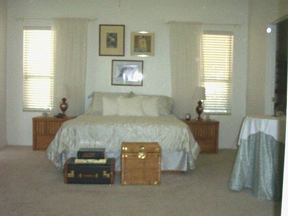 Spacious master bedroom has a spa-like bath, with jacuzzi tub.