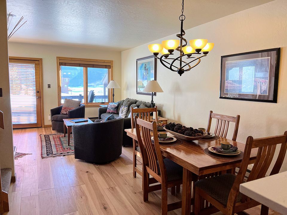 Living area, comfortable swivel chairs and sofa sleeper. New hardwood floors throughout main floor.