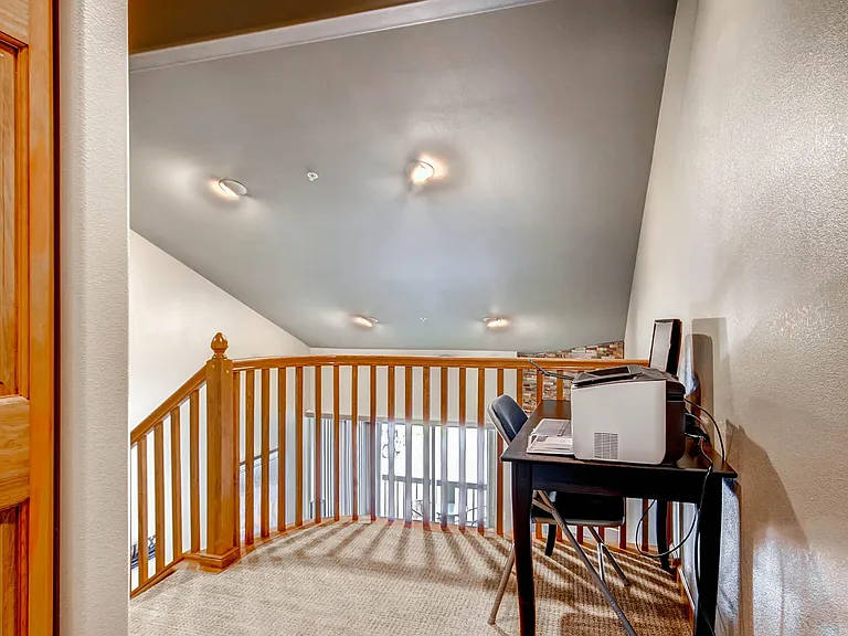Office alcove with laser printer and monitors