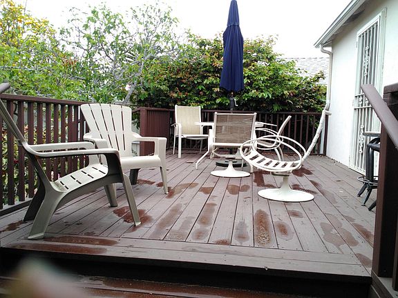Large patio deck in rear of house