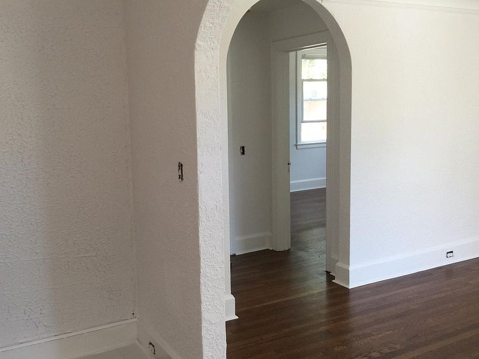 View from kitchen through living room into hallway