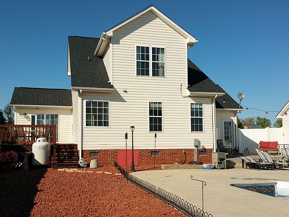 Back of house with deck