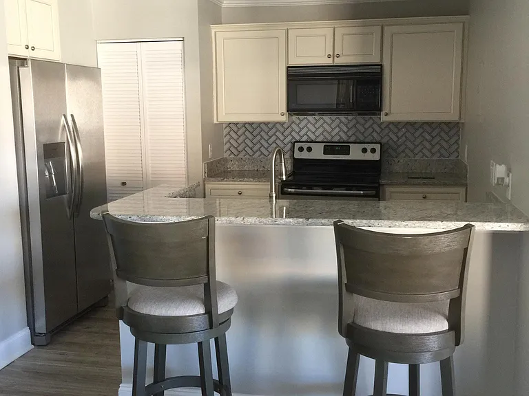 Updated kitchen with refrigerator, stove, microwave, dishwasher and washer/dryer
