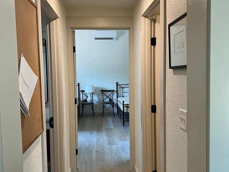 Hall to primary bedroom, bathroom, and walk in closet.