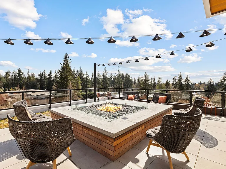 Rooftop deck with fire pits and seating areas