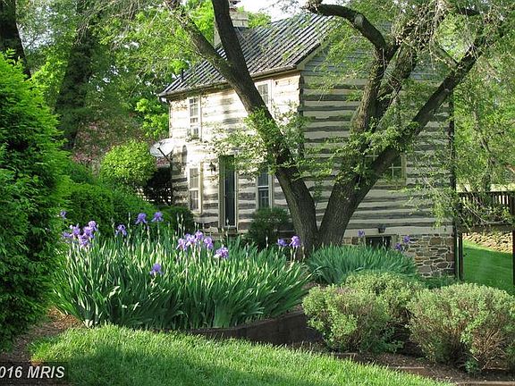 Log cabin and landscaping