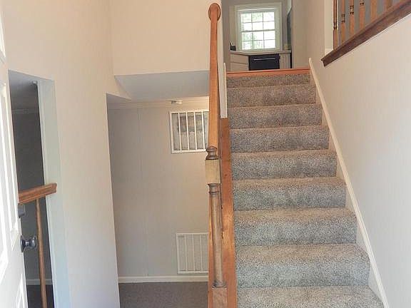 Welcoming open foyer-new flooring, paint, lighting